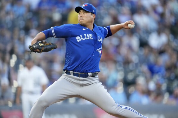 FILE - Toronto Blue Jays starting pitcher Hyun Jin Ryu works against the Colorado Rockies during the first inning of a baseball game on Sept. 1, 2023, in Denver. Former Toronto Blue Jays pitcher Hyun Jin Ryu looks set to return to South Korea after 10 years in Major League Baseball, South Korean media reported. (AP Photo/David Zalubowski, File)