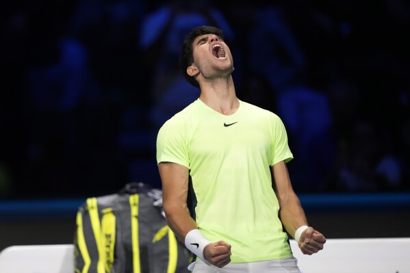 Spain's Carlos Alcaraz celebrates after winning the singles tennis match against Russia's Daniil Medvedev, of the ATP World Tour Finals at the Pala Alpitour, in Turin, Italy, Friday, Nov. 17, 2023. (AP Photo/Antonio Calanni)