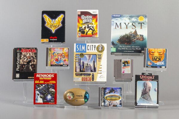 This image provided by The Strong shows 12 finalists being considered for induction into the World Video Game Hall of Fame in Rochester, N.Y. Asteroids, Elite, Guitar Hero, Metroid, Myst, Neopets, Resident Evil, SimCity, Tokimeki Memorial, Tony Hawk's Pro Skater, Ultima, and You Don't Know Jack. Three or four of the finalists will be inducted in May following voting by a panel of judges and the public. (Evyn Morgan/The Strong via AP)