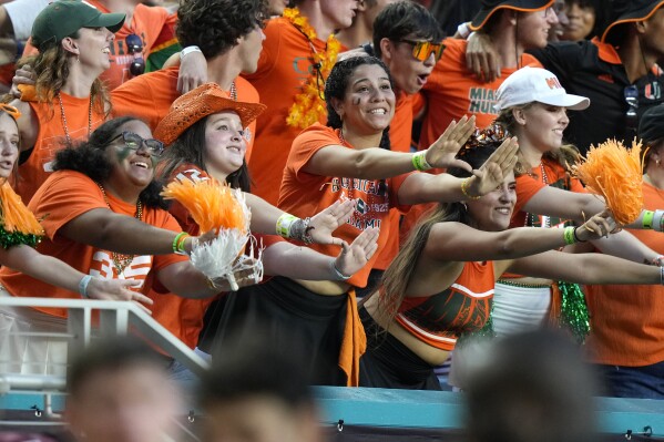 Miami fans cheer during the second half of an NCAA college football game between Miami and Texas A&M, Saturday, Sept. 9, 2023, in Miami Gardens, Fla. (AP Photo/Lynne Sladky)