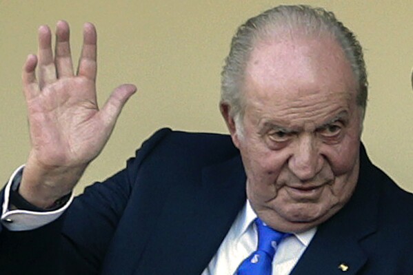 FILE - In this file photo dated June 2, 2019, Spain's former King Juan Carlos waves at the bullring in Aranjuez, Spain. Former Spanish King Juan Carlos I has won his London court battle with an ex-lover who sought $153 million in damages for allegedly being harassed and spied after their breakup. Danish socialite and businessperson Corinna Larsen, also known as Corinna zu Sayn-Wittgenstein said the former monarch caused her “great mental pain” by orchestrating threats and ordering unlawful covert and overt surveillance of her. A London judge tossed out her case and ruled that British courts don't have jurisdiction over the case because Larsen hadn't proved the harassment occurred in England and the king doesn't live there. (AP Photo/Andrea Comas, FILE)