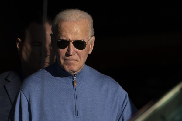 President Joe Biden walks out of Jos A. Bank in Greenville, Del., Saturday, Nov. 18, 2023. (AP Photo/Manuel Balce Ceneta)