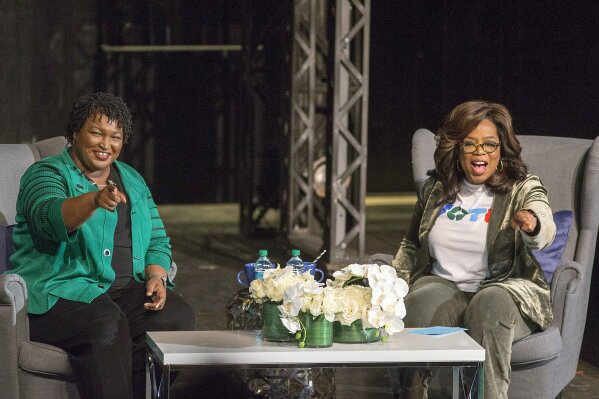 
              Oprah Winfrey and Georgia gubernatorial candidate Stacey Abrams greet a crowd gathered for a town hall conversation at the Cobb Civic Center's Jennie T. Anderson Theatre in Marietta, Ga., Thursday, Nov. 1, 2018. Winfrey visited Georgia on Thursday to canvass neighborhoods in Metro Atlanta and show her support for gubernatorial candidate Stacey Abrams. (Alyssa Pointer /Atlanta Journal-Constitution via AP)
            