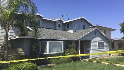 FILE - Tape surrounds the home occupied by Stephen Beal in Long Beach, Calif., on May 16, 2018. Beal has been convicted of blowing up his ex-girlfriend's spa business with a package bomb in 2018, killing her and seriously injuring two clients. A federal jury in Los Angeles on Wednesday, July 19, 2023 convicted Beal of four felonies including use of a weapon of mass destruction resulting in death. (AP Photo/Amanda Lee Myers, File)