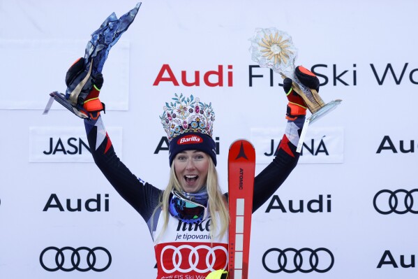 FILE - United States' Mikaela Shiffrin celebrates on the podium after winning an alpine ski, women's World Cup slalom race, in Jasna, Slovakia, Sunday, Jan. 21, 2024. Mikaela Shiffrin’s return from her downhill crash is still on schedule for this weekend in Åre. (AP Photo/Giovanni Maria Pizzato, File)