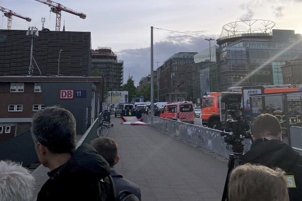 Emergency services at the scene of a stabbing at Hamburg Central Station in Hamburg, Germany, Friday, May 23, 2025. (Lukas Mueller/dpa via AP)