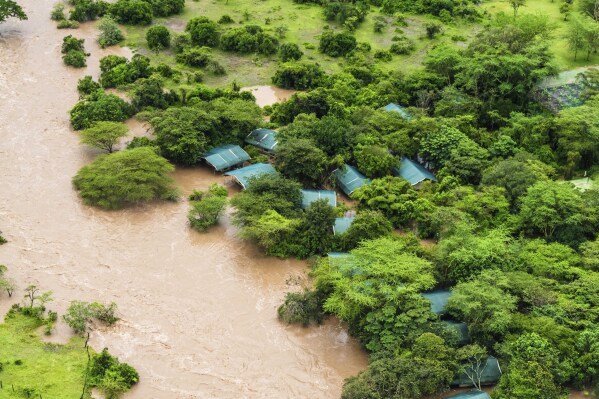 FILE - A shelter is seen in the flooded Maasai Mara National Reserve, which left dozens of tourists stranded in Narok County, Kenya, May 1, 2024. The impact of devastating rains that hit East Africa from March to May was intensified by a mix of climate change and rapid urban growth, an international team of climate scientists said in a study.  (AP Photo/Bobby Neptune, File)