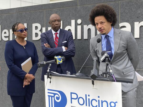 Comedian Eric André, right, speaks at a news conference outside the federal courthouse in Atlanta on Tuesday, Oct. 11, 2022, as his attorneys Allegra Lawrence-Hardy, left, and Richard Deane watch. André and comedian Clayton English filed a lawsuit Tuesday alleging that they were racially profiled and illegally stopped by Clayton County police at Hartsfield-Jackson Atlanta International Airport. They say officers singled them out during separate stops roughly six months apart because they are Black and grilled them about drugs as other passengers watched. (AP Photo/Kate Brumback)