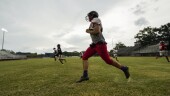 Members of the Baker High football team warm up at practice in Baker, La., Wednesday, Aug. 28, 2024. (AP Photo/Gerald Herbert)