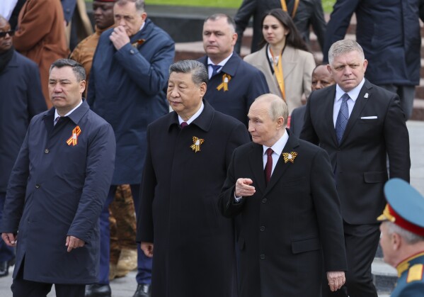 From left: Kyrgyz President Sadyr Japarov Chinese President Xi Jinping, Russian President Vladimir Putin and Slovakia's Prime Minister Robert Fico attend a wreath laying ceremony at the Tomb of the Unknown Soldier in Alexander Garden after the Victory Day military parade in Moscow, Russia, Friday, May 9, 2025, during celebrations of the 80th anniversary of the Soviet Union's victory over Nazi Germany during the World War II. (Yuri Kochetkov/Pool Photo via AP)