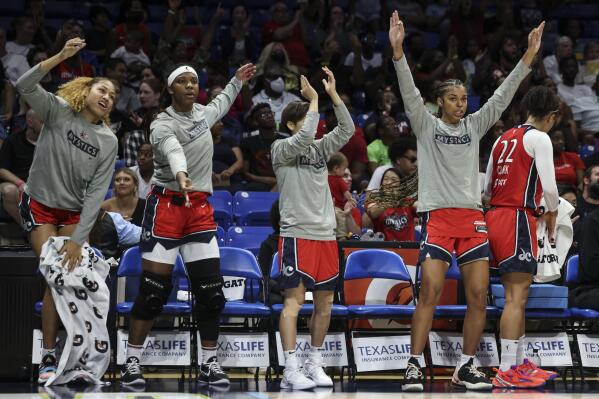 Washington Mystics on the bench celebrate a 3-pointer against the Dallas Wings during the first half of a WNBA basketball game Thursday, July 28, 2022, in Arlington, Texas. (Rebecca Slezak/The Dallas Morning News via AP)
