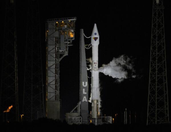 In this photo released by NASA, a United Launch Alliance Atlas V rocket with the Lucy spacecraft stands ready to launch from Space Launch Complex 41, Saturday, Oct. 16, 2021, at Cape Canaveral Space Force Station in Florida. Lucy will be the first spacecraft to study Jupiter's Trojan Asteroids. Like the mission's namesake – the fossilized human ancestor, "Lucy," whose skeleton provided unique insight into humanity's evolution – Lucy will revolutionize our knowledge of planetary origins and the formation of the solar system. (Bill Ingalls/NASA via AP)