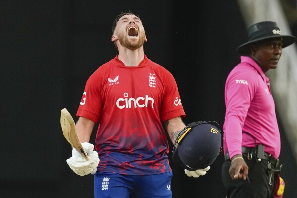 England's Phil Salt celebrates after he scored a century against West Indies during the fourth T20 cricket match at Brian Lara Stadium in Tarouba, Trinidad and Tobago, Tuesday, Dec. 19, 2023. (AP Photo/Ricardo Mazalan)