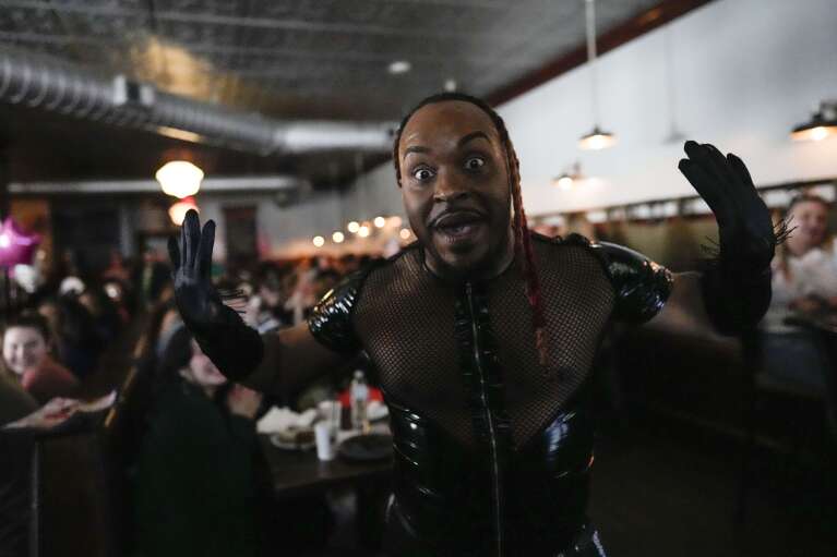 Carlos Ova-Dupree performs during the "Mimosas & Heels Drag Brunch" at the Public House, Sunday, March 5, 2023, in Norfolk, Va. The drag bunch was hosted by Harpy Daniels and Javon Love. (AP Photo/Carolyn Kaster)