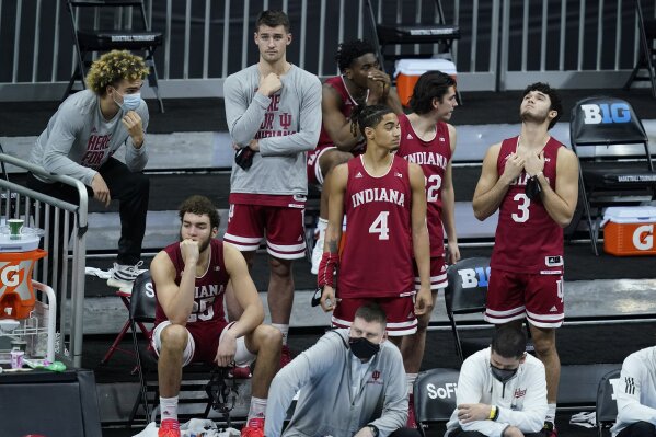 Indiana players watch in the final seconds of an NCAA college basketball game against Rutgers at the Big Ten Conference tournament, Thursday, March 11, 2021, in Indianapolis. Rutgers won 61-50. (AP Photo/Darron Cummings)