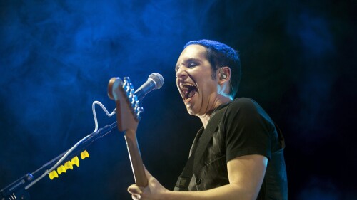 FILE - Brian Molko performs with his alternative rock band Placebo of Britain in Papp Laszlo Sports Arena in Budapest, Hungary, Friday, Nov. 11, 2016. Prosecutors in Turin, Italy, have reportedly opened an investigation after the lead singer of British band Placebo insulted Premier Giorgia Meloni during a July 11 concert, calling her a fascist and racist. (Balazs Mohai/MTI via AP, File)