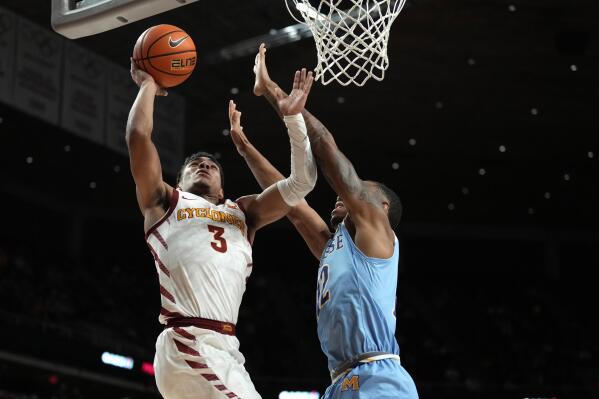 Iowa State guard Tamin Lipsey (3) shoots a basket past McNeese State forward Dionjahe Thomas (12) during the first half of an NCAA college basketball game, Sunday, Dec. 11, 2022, in Ames, Iowa. (AP Photo/Matthew Putney)