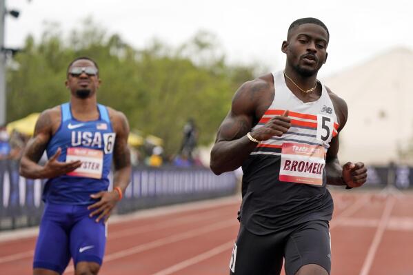 FILE - In this Saturday, May 15, 2021, file photo, Trayvon Bromell, right, wins the 100-meter dash during the Sound Running Track Meet in Irvine, Texas. Bromell is one of the favorites in a 100-meter field that includes Noah Lyles  and veteran Justin Gatlin at the U.S. Olympic track and field trials. (AP Photo/Marcio Jose Sanchez, File)