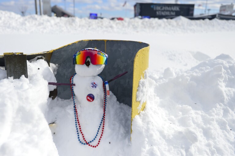 A snowman decorated with Buffalo Bills paraphernalia sits outside Highmark Stadium before an NFL football game between the Buffalo Bills and the Pittsburgh Steelers, Monday, Jan. 15, 2024, in Buffalo, N.Y. (AP Photo/Adrian Kraus)
