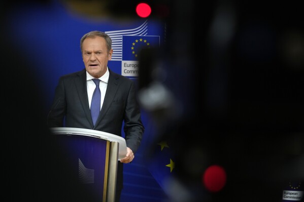 Leader of the Polish Civic Coalition Donald Tusk addresses a media conference prior to a meeting with European Commission President Ursula von der Leyen at EU headquarters in Brussels, Wednesday, Oct. 25, 2023. (AP Photo/Virginia Mayo)