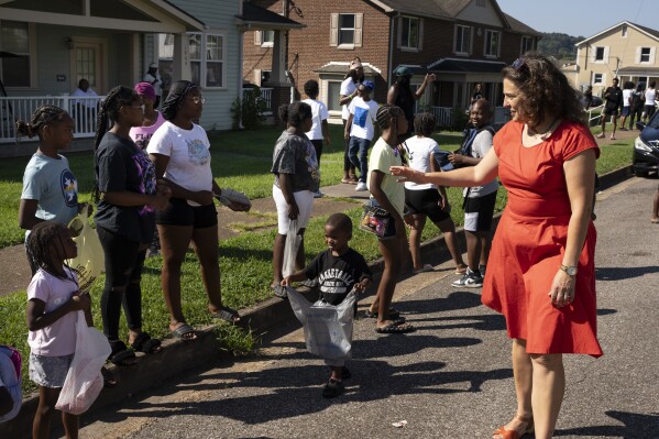 Mayor Indya Kincannon visits with members of the Lonsdale neighborhood during a homecoming celebration Saturday, Aug. 5, 2023 in Knoxville, Tenn. (AP Photo/George Walker IV)