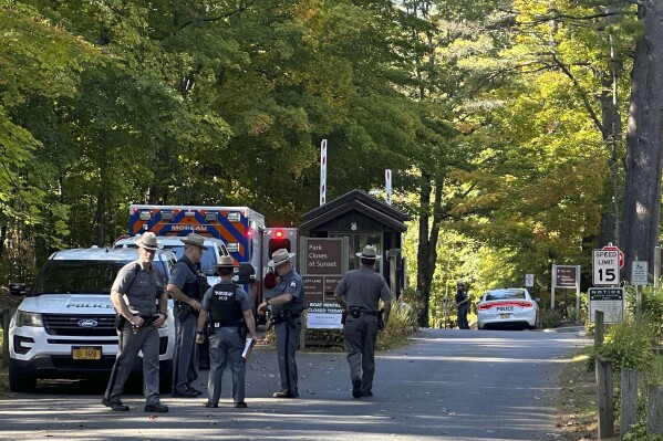 Police secure the entrance to Moreau Lake State Park as search continues for Charlotte Sene, a missing 9-year-old girl who had been camping over the weekend with her family at the park, Monday Oct. 2, 2023, in New York. (AP Photo/Michael Hill)