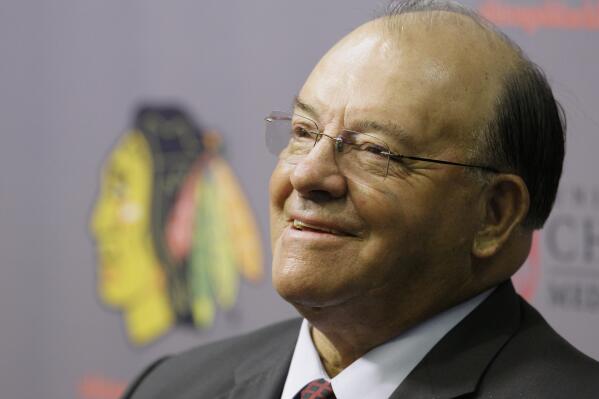 FILE - Scotty Bowman answers questions as he is introduced as the new senior advisor for hockey operations for the Chicago Blackhawks on Thursday, July 31, 2008. When Scotty Bowman left the Chicago Blackhawks a year ago, he was open to taking another job. During the course of this season, the 89-year old Hall of Famer discovered not working for a team can be a good thing.(AP Photo/M. Spencer Green, File)