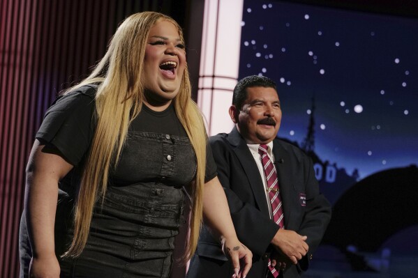This image released by Disney shows TikTok creator Jools Lebron, left, with talk show personality Guillermo Rodriguez on the set of "Jimmy Kimmel Live!" on Monday, Aug. 19, 2024 in Los Angeles. (Randy Holmes/ABC-Disney via AP)