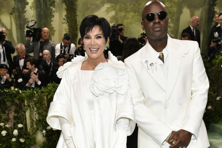 Kris Jenner, left, and Corey Gamble attend The Metropolitan Museum of Art's Costume Institute benefit gala celebrating the opening of the "Sleeping Beauties: Reawakening Fashion" exhibition on Monday, May 6, 2024, in New York. (Photo by Evan Agostini/Invision/AP)