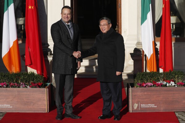 Chinese Premier Li Qiang, right, is greeted by Ireland's Prime Minister Leo Varadkar at Farmleigh House, during a visit to Dublin, Ireland, Wednesday, Jan. 17, 2024. Chinese Premier Li Qiang is visiting for talks on China's relations with the European Union and other global and bilateral issues. (AP Photo/Peter Morrison)