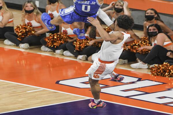 Clemson guard David Collins (13) fouls Duke forward Wendell Moore Jr (0) during the first half of an NCAA college basketball game in Clemson, S.C., Thursday, Feb. 10, 2022. Collins was ejected. Duke beat Clemson 82-64. (Ken Ruinard/The Independent-Mail via AP)