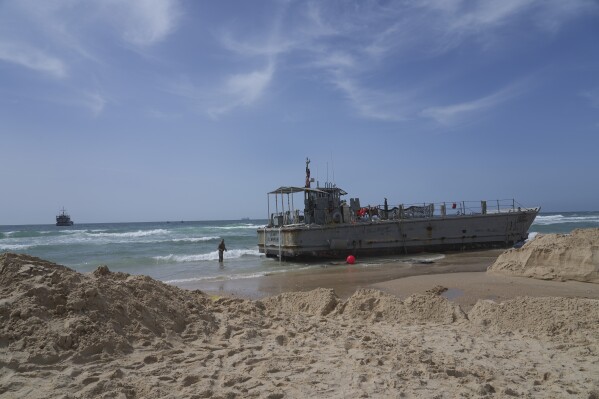 A U.S. Army landing craft is seen beached in Ashdod on Sunday, May 26, 2024, after being swept by wind and current from the temporary humanitarian pier in the Gaza Strip. (AP Photo/Tsafrir Abayov)