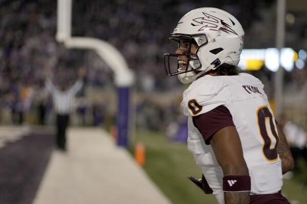 Arizona State wide receiver Jordyn Tyson celebrates after scoring a touchdown during the first half of an NCAA college football game against Kansas State Saturday, Nov. 16, 2024, in Manhattan, Kan. (AP Photo/Charlie Riedel)