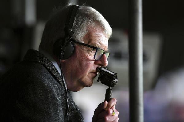 FILE - Britain's football commentator John Motson follows a match, May 13, 2018. Motson has died at the age of 77. He was one of the most well-known voices in British sport for 50 years. The BBC announced the death of Motson on Thursday, Feb. 23, 2023 without giving any details. Motson was fondly known as “Motty.” He called games for Britain’s national broadcaster from 1968-2018. He covered 10 World Cups, 10 European Championships and 29 FA Cup finals during that time. (Dominic Lipinski/PA via AP, File)