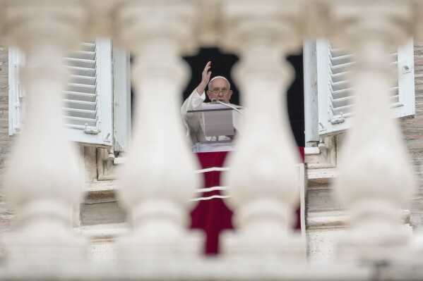 Pope Francis delivers his blessing as he recites the Angelus noon prayer from the window of his studio overlooking St.Peter's Square at the Vatican, on the occasion of All Saints Day, Wednesday, Nov. 1, 2023. (AP Photo/Andrew Medichini)