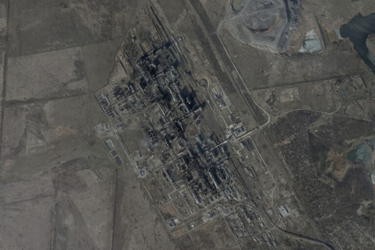 This satellite image from Feb. 26, 2024 shows Avdiivka's coke plant after Ukrainian troops withdrew from the city in February 2024. The loss of the city of Avdiivka last month marked the end of a long, exhausting defense for the Ukrainian military. One brigade had defended the same block of buildings for months without a break. (Planet Labs via AP)