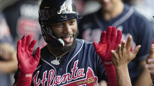 Atlanta Braves' Michael Harris II celebrates with teammates in the dugout following his home run in the fifth inning of a baseball game against the Cleveland Guardians, Monday, July 3, 2023, in Cleveland. (AP Photo/Sue Ogrocki)