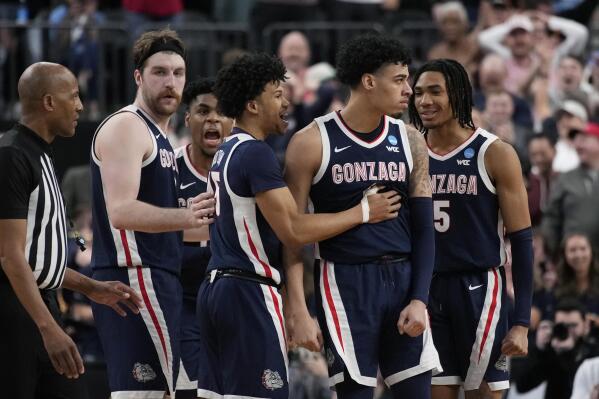 Gonzaga players celebrate during the final seconds in the second half of a Sweet 16 college basketball game against UCLA in the West Regional of the NCAA Tournament, Thursday, March 23, 2023, in Las Vegas. (AP Photo/John Locher)