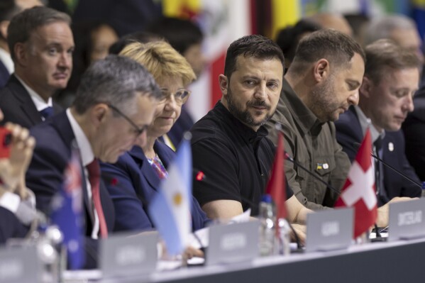 Ukrainian President Volodymyr Zelenskyy, centre, attends the plenary session during the Summit on peace in Ukraine, in Obbürgen, Switzerland, Sunday, June 16, 2024. (Michael Buholzer/Keystone via AP)