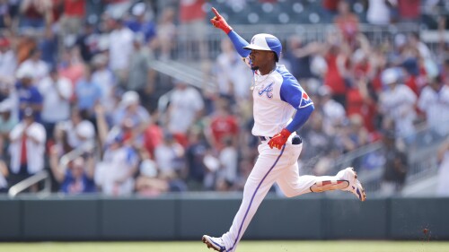 Atlanta Braves second baseman Ozzie Albies (1) gestures after hitting a single home run in the first inning against the Miami Marlins during a baseball game Saturday, July 1, 2023, in Atlanta. (AP Photo/Alex Slitz)