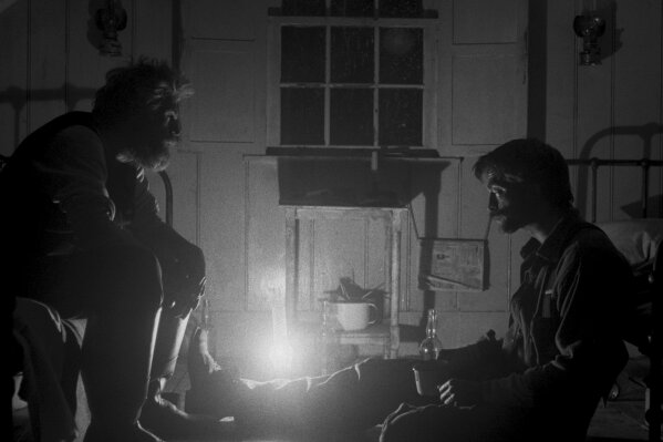 This image released by A24 Films shows Willem Dafoe, left, and Robert Pattinson in a scene from "The Lighthouse." (A24 Pictures via AP)