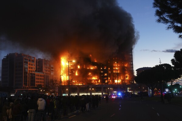 A housing block burns in Valencia, Spain, Thursday, Feb. 22, 2024. A fire engulfed two residential buildings in the eastern Spanish city of Valencia on Thursday, with reported injuries. (APPhoto/Alberto Saiz)
