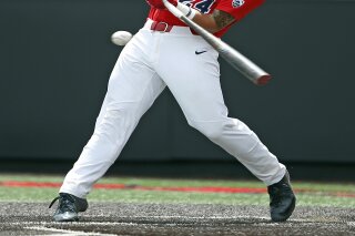 FILE - In this Sunday, June 4, 2017 file photo, Arizona's J.J. Matijevic (24) hits a fly ball against Sam Houston State during an NCAA college baseball regional game in Lubbock, Texas. Houston Astros third base prospect J.J. Matijevic has been suspended for 50 games under baseball's minor league drug program following a second positive test for a drug of abuse, Tuesday, April 30, 2019.(Brad Tollefson/Lubbock Avalanche-Journal via AP, File)