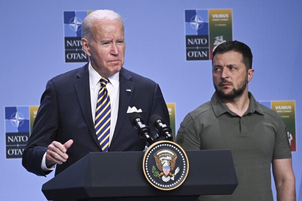 FILE - President Joe Biden, left, speaks at an event with G7 leaders and Ukrainian President Volodymyr Zelensky during the NATO Summit, in Vilnius, Lithuania, July 12, 2023. Biden's strong backing for Ukraine's effort to repel Russia's invasion has been the rare issue where he's mustered bipartisan support. But this week’s first GOP presidential debate—and recent comments by former President Donald Trump on Ukraine— suggest that the dynamic will face a stress test as the 2024 presidential campaign heats up. (Paul Ellis/Pool Photo via AP, File)