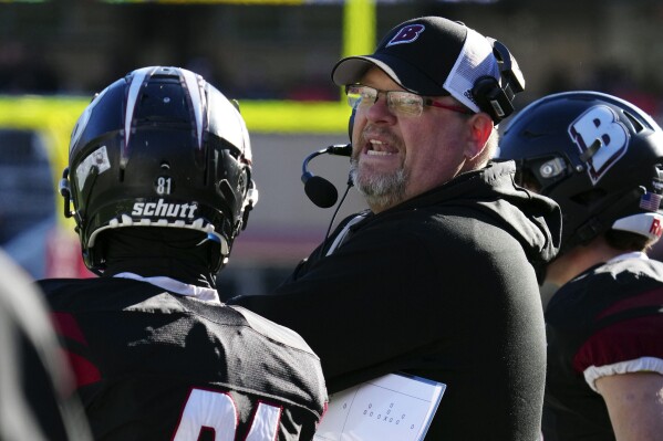 Lake Geneva Badger head coach Matt Hensler talks with players during the WIAA Division 2 state championship football game against Waunakee at Camp Randall Stadium in Madison on Friday, Nov. 17, 2023. Hensler has been named The Associated Press' Wisconsin high school football coach of the year. (Scott Ash/Milwaukee Journal-Sentinel via AP)