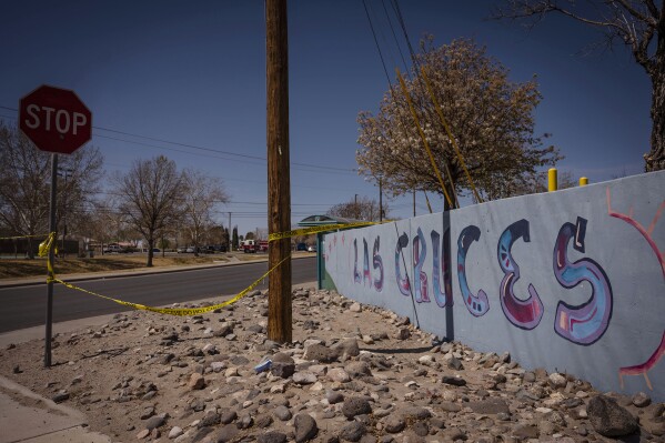 Crime scene tape blocks off Young Park after Friday night's fatal shooting in Las Cruces, N.M., on Saturday, March 22, 2025. (Chancey Bush/The Albuquerque Journal via AP)