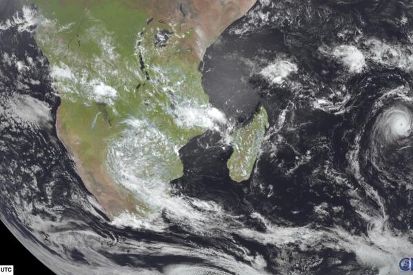 This image from Meteosat-9 satellite shows Cyclone Freddy, right, in the Indian Ocean near Madagascar, Friday, Feb. 17, 2023. Two weeks after Tropical Cyclone Cheneso devastated Madagascar, the Indian Ocean island nation and its neighbors are bracing for a more powerful Cyclone Freddy. (NOAA via AP)