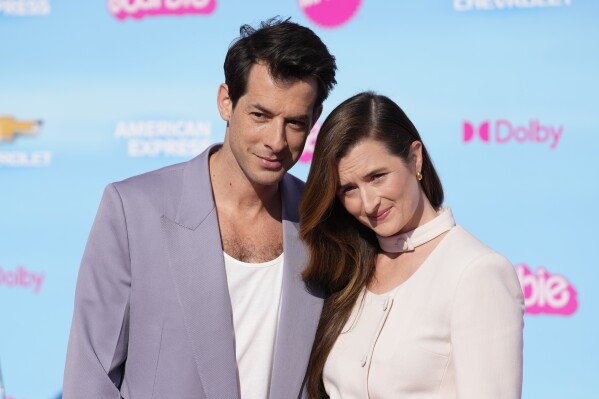 Mark Ronson, left, and Grace Gummer arrive at the premiere of "Barbie" on Sunday, July 9, 2023, at The Shrine Auditorium in Los Angeles. (AP Photo/Chris Pizzello)