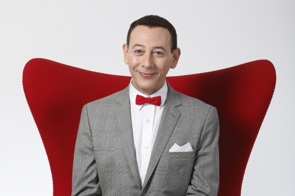 FILE - Actor Paul Reubens portraying Pee-wee Herman poses for a portrait while promoting "The Pee-wee Herman Show" live stage play, Monday, Dec. 7, 2009, in Los Angeles. Reubens died Sunday night after a six-year struggle with cancer that he did not make public, his publicist said in a statement. (AP Photo/Danny Moloshok, File)