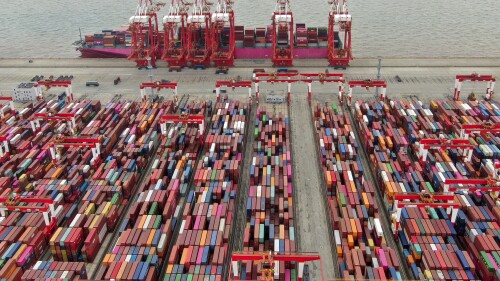 FILE - The Yangshan container port is seen in an aerial view in Shanghai, China on July 10, 2021. China’s exports tumbled in June, 2023, by 12.4% compared with a year earlier amid weaker global demand and higher inflation. (Chinatopix via AP, File)